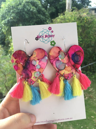 Tye dye rainbow heart dangles with tassels
