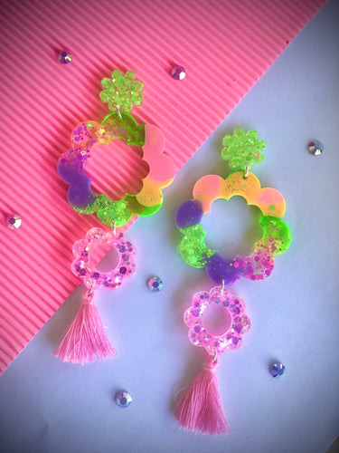 Electric pink daisy dangles with tassels