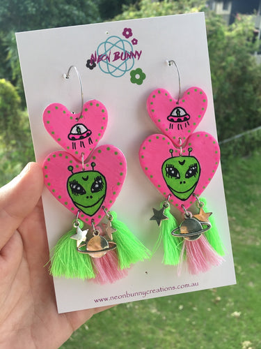 Pink alien heart dangles with tassels