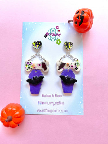 Bad to the bone coffin candy dangles