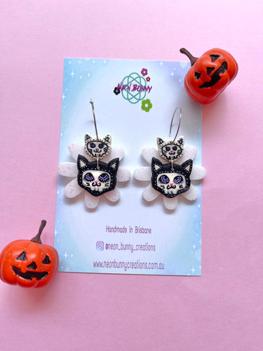 Skeleton kitty daisy earrings