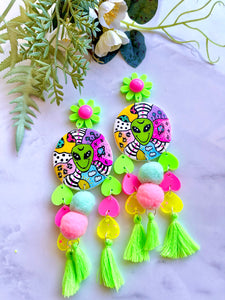 Alien world statement dangles with Pom poms and tassels